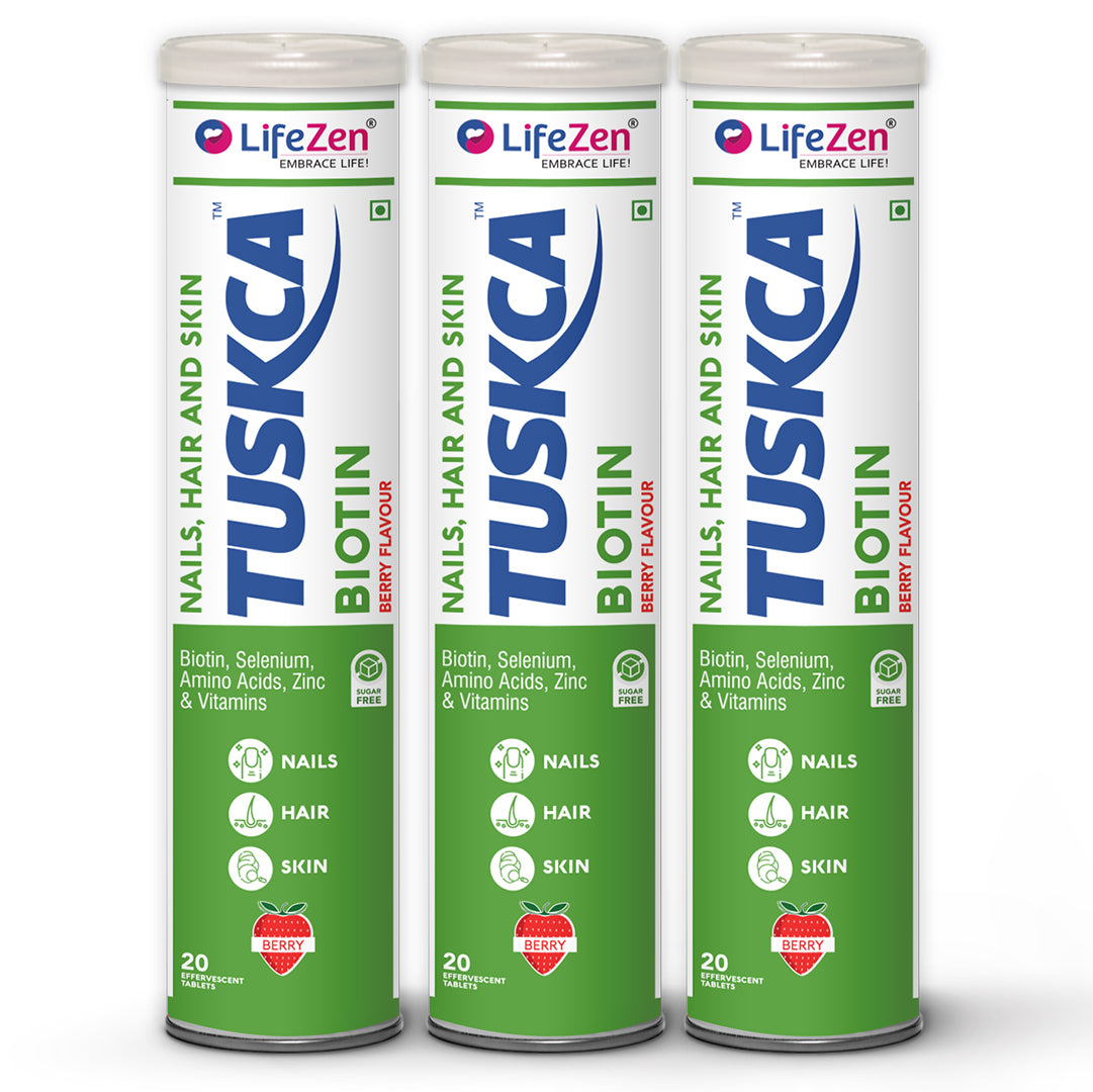 Three LifeZen TUSKCA Biotin supplement cans on a white background