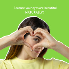 Woman making a heart shape with her hands against a green background with text 'Because your eyes are beautiful NATURALLY!'.
