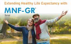 A vibrant mid-50s couple gesturing outwards, promoting MNF GR syrup for extending healthy life expectancy.