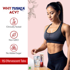 A fit woman dropping a Tuskca Apple cider Vinegar Tablet in a glass of water. 